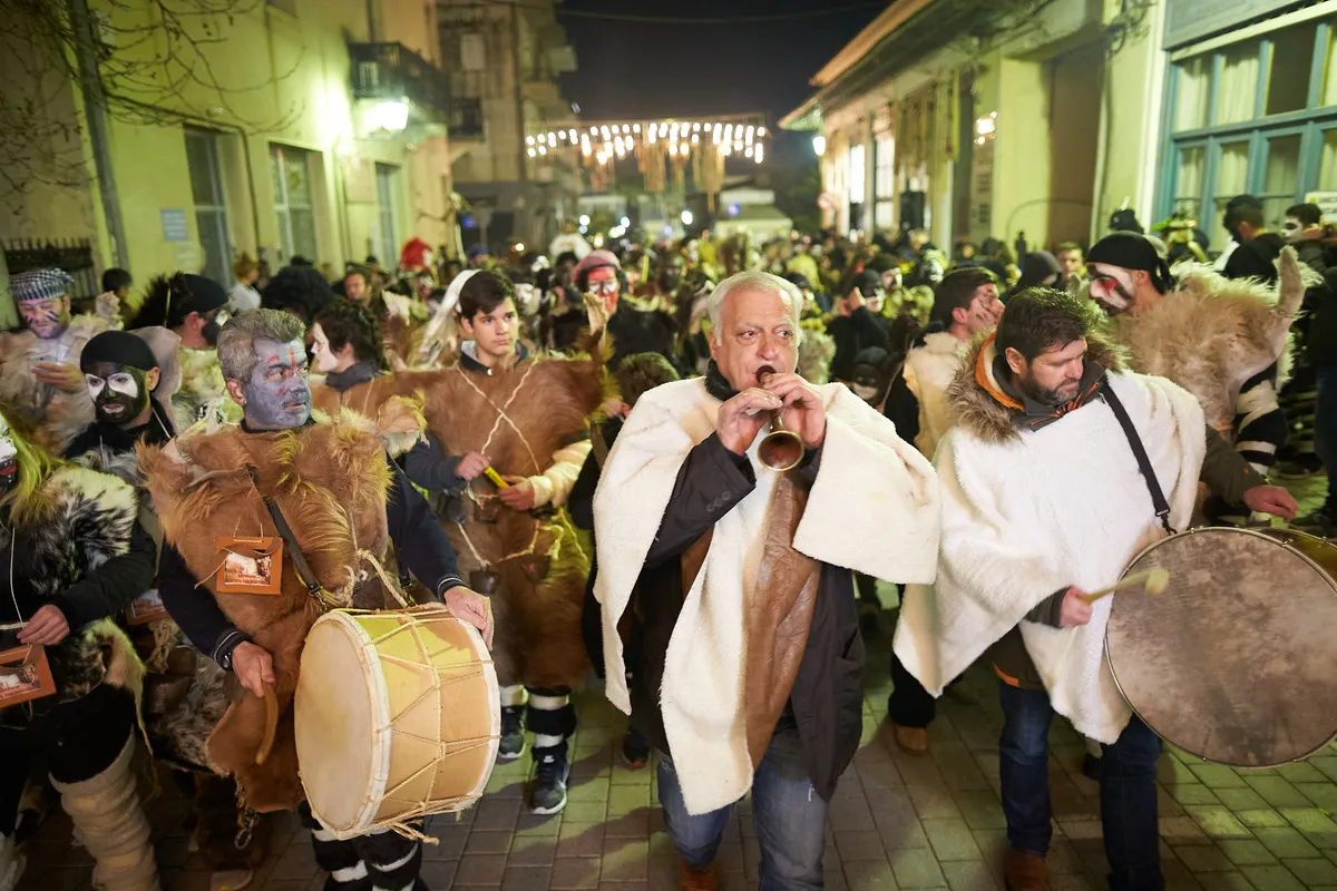 Carnival night procession with traditional drums and goatskin costumes in a Greek town